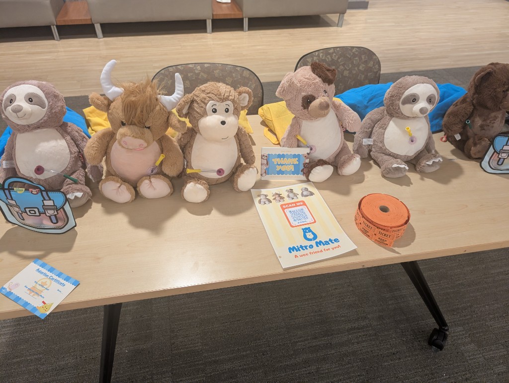 Stuffed animals and comfort items set out at the Bladder Exstrophy Conference